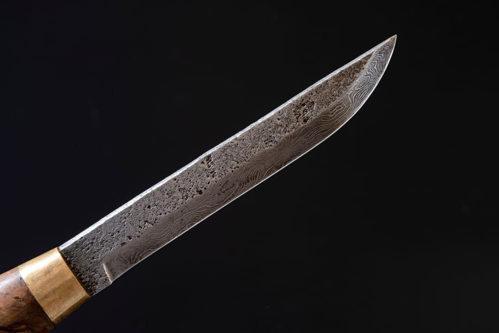A close view of a worn blade edge