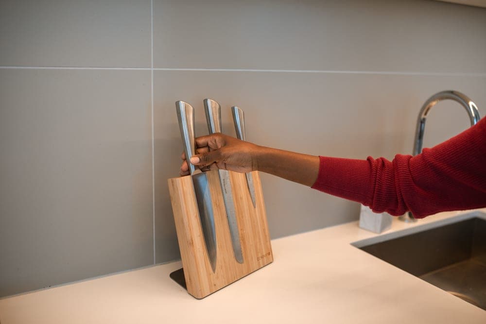 Kitchen knives stored on a wooden surface