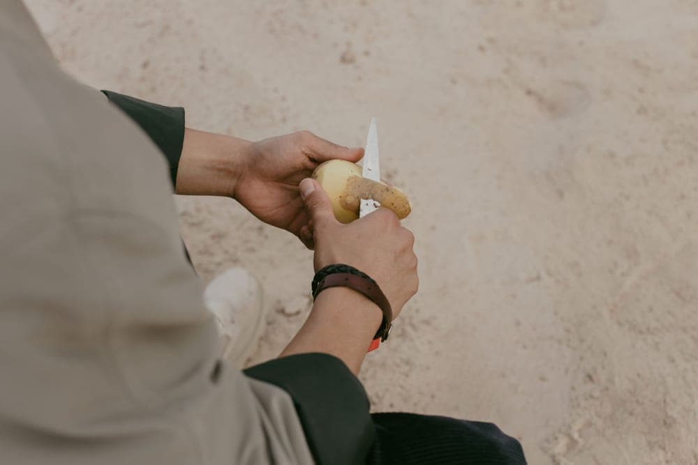 A small kitchen knife being used for close prep work